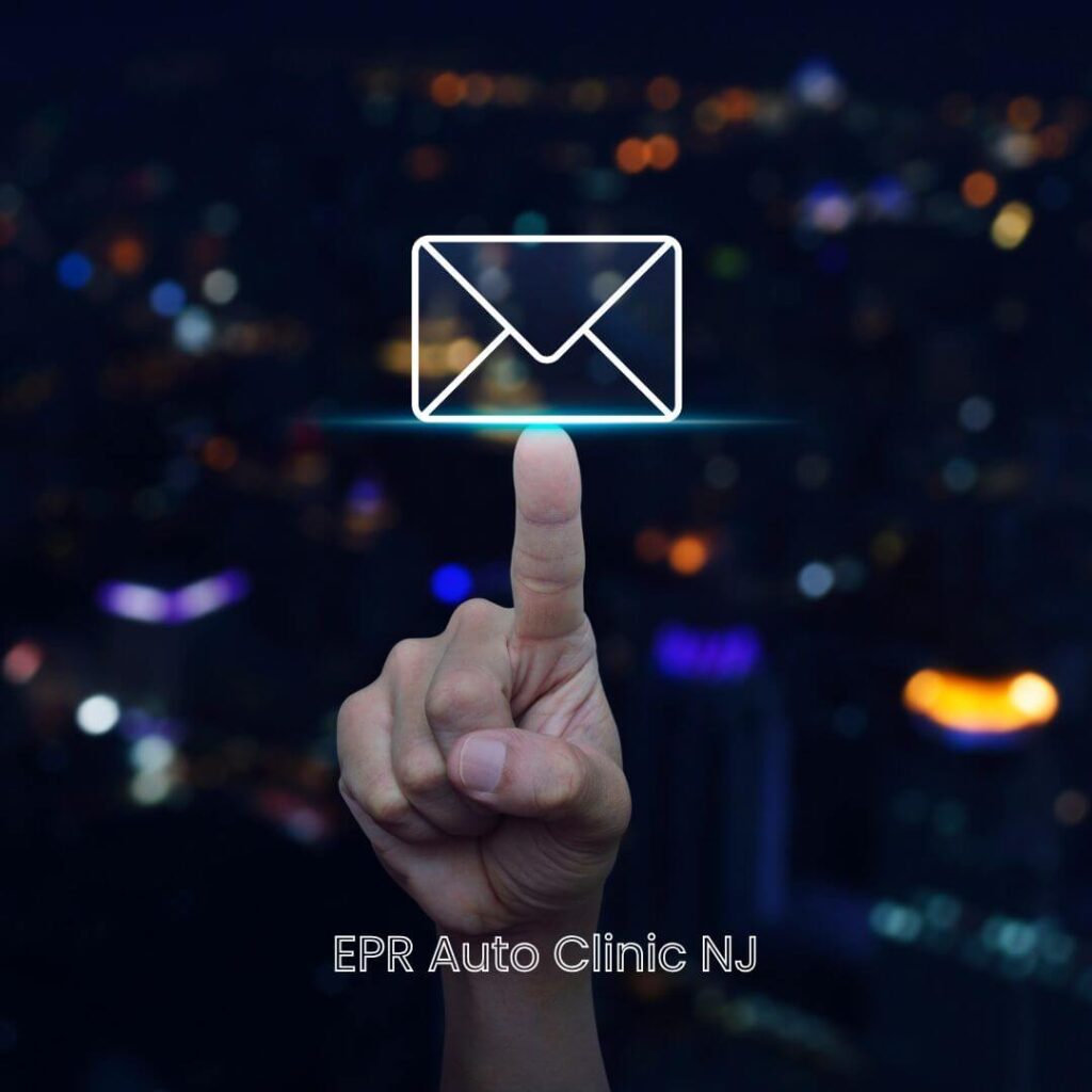 EPR Auto Clinic in Newark, NJ 9 A hand touching a glowing digital mail icon, symbolizing how to easily contact EPR Auto Clinic in Newark to ask a question or schedule service