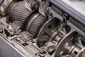 Close-up of internal Ford transmission gears during diagnostic and repair service in Newark, NJ